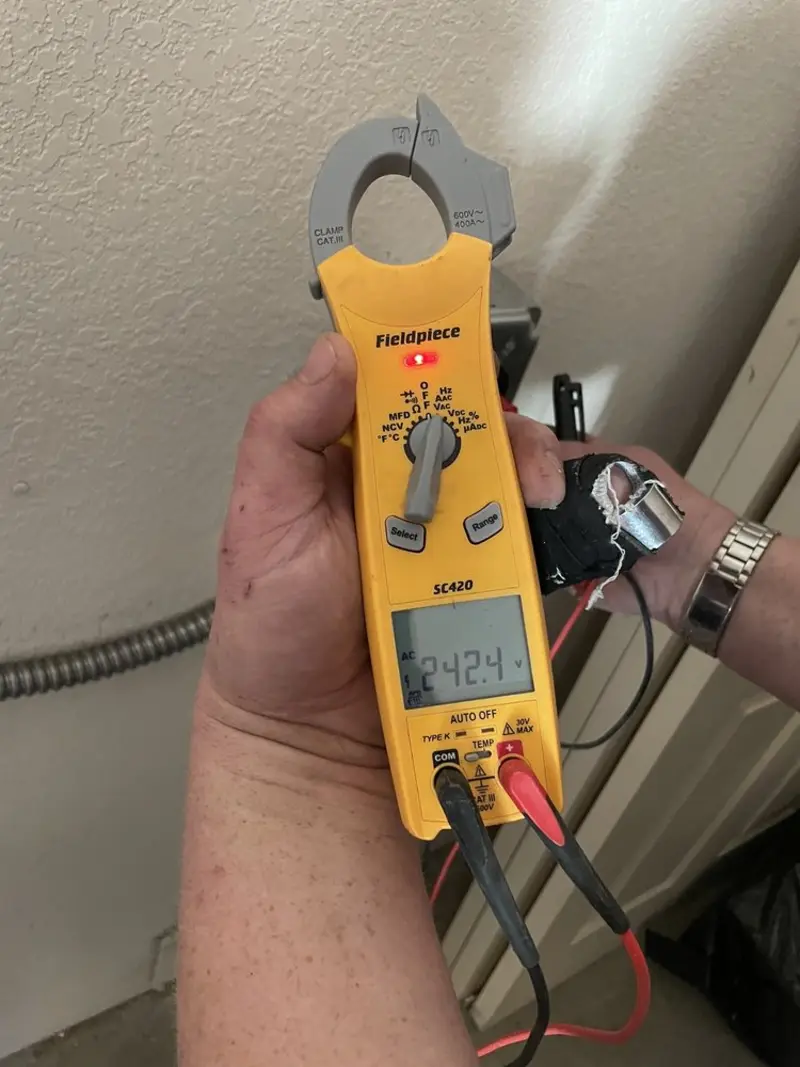 Voltage testing with clamp meter during Circuit Breaker Repair in Champlin
